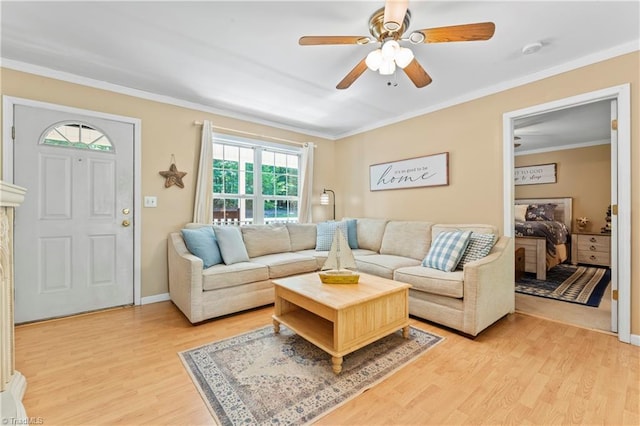 1044 Riverwood Rd, Lexington, NC 27292 - living room featuring light wood-style flooring, a ceiling fan, ornamental molding, and baseboards
