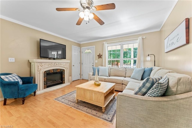 1044 Riverwood Rd, Lexington, NC 27292 - living room featuring light wood-style floors, ceiling fan, ornamental molding, and a high end fireplace
