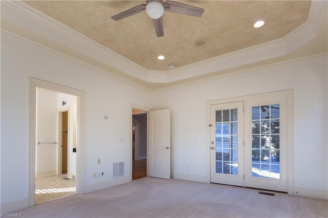 unfurnished bedroom featuring crown molding, light colored carpet, access to outside, a raised ceiling, and ceiling fan