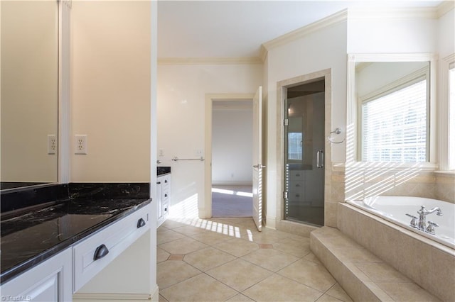 bathroom featuring independent shower and bath, vanity, ornamental molding, and tile patterned floors