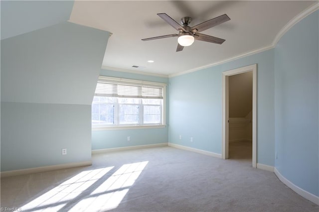 carpeted empty room with ornamental molding and ceiling fan