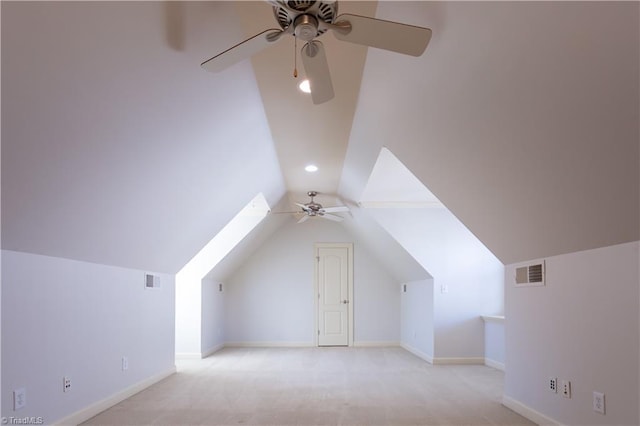 bonus room featuring light carpet, lofted ceiling, and ceiling fan