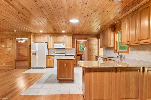 7849 Circle L Trl, Rougemont, NC 27572 - kitchen featuring white appliances, decorative backsplash, a peninsula, wooden ceiling, and light stone countertops