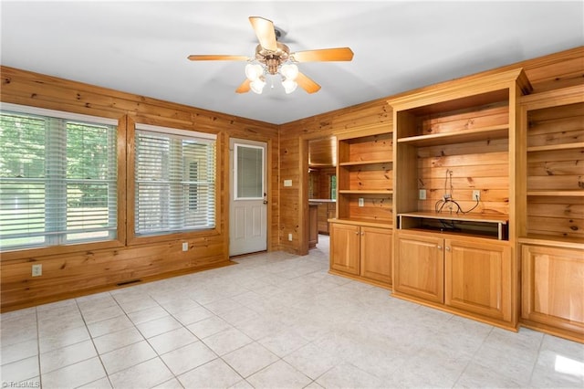 7849 Circle L Trl, Rougemont, NC 27572 - unfurnished living room with wooden walls and ceiling fan