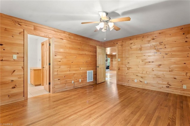 7849 Circle L Trl, Rougemont, NC 27572 - empty room featuring ceiling fan, light wood-style flooring, and wood walls