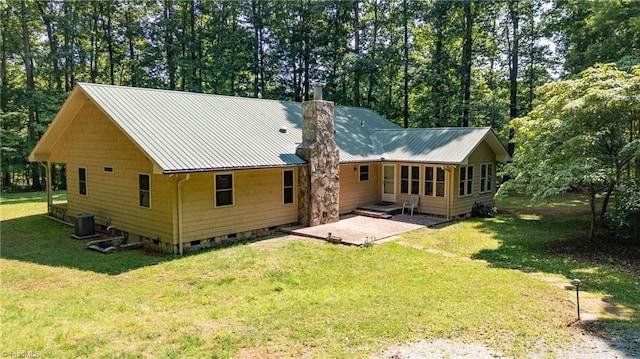 7849 Circle L Trl, Rougemont, NC 27572 - back of house featuring crawl space, a patio, a lawn, and a chimney