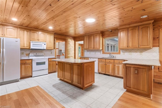7849 Circle L Trl, Rougemont, NC 27572 - kitchen featuring white appliances, light tile patterned floors, a kitchen island, backsplash, and recessed lighting
