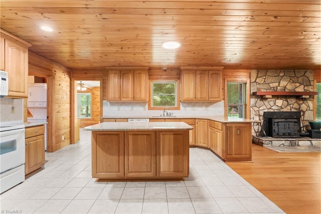 7849 Circle L Trl, Rougemont, NC 27572 - kitchen with white appliances, a kitchen island, backsplash, wood ceiling, and light tile patterned floors