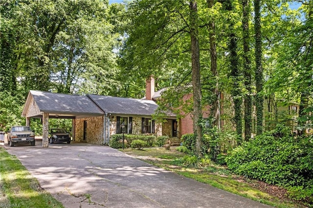 1204 Hobbs Rd, Greensboro, NC 27410 - view of front of home with driveway, a chimney, an attached carport, and stone siding