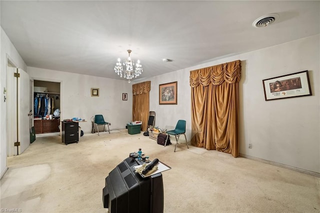 1204 Hobbs Rd, Greensboro, NC 27410 - carpeted living area featuring a chandelier