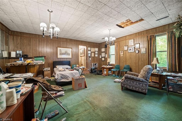 1204 Hobbs Rd, Greensboro, NC 27410 - carpeted bedroom with a chandelier and wooden walls