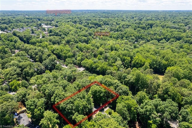 1204 Hobbs Rd, Greensboro, NC 27410 - aerial view of property's location with a heavily wooded area and property parcel outlined