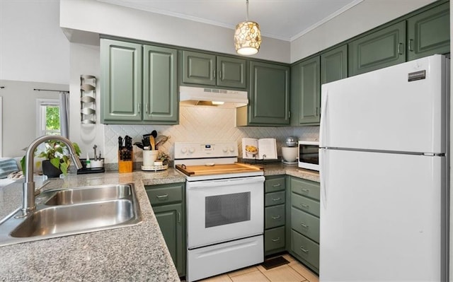 kitchen featuring under cabinet range hood, green cabinetry, and white appliances