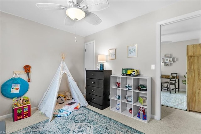 game room featuring carpet flooring, baseboards, and a ceiling fan