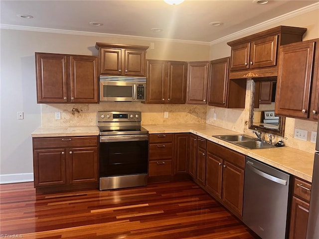 kitchen featuring appliances with stainless steel finishes, dark hardwood / wood-style floors, and decorative backsplash