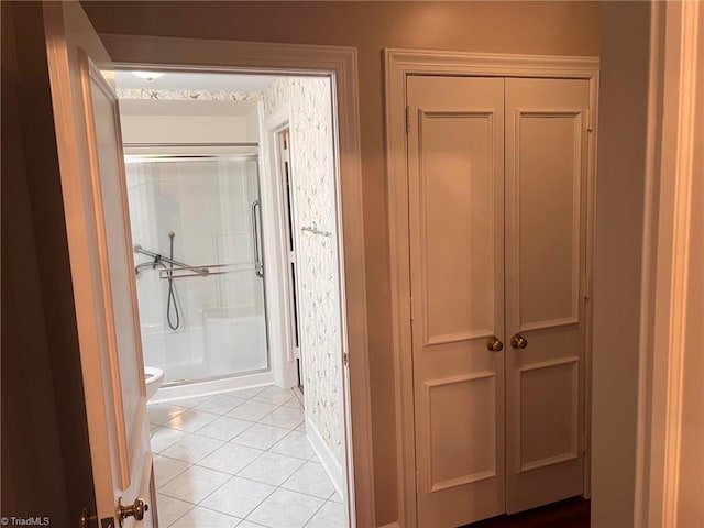 hall featuring light tile patterned floors