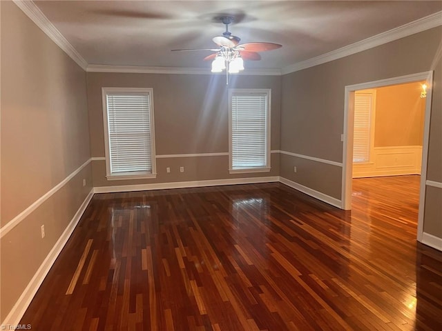 spare room with ornamental molding, dark wood-type flooring, and ceiling fan