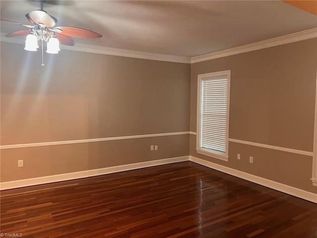 spare room featuring ornamental molding, ceiling fan, and dark hardwood / wood-style floors