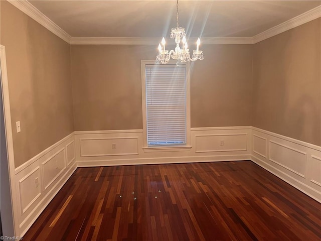 unfurnished room featuring dark hardwood / wood-style floors, an inviting chandelier, and ornamental molding