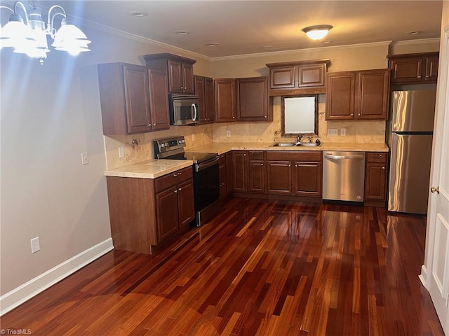 kitchen featuring backsplash, stainless steel appliances, dark hardwood / wood-style flooring, sink, and ornamental molding