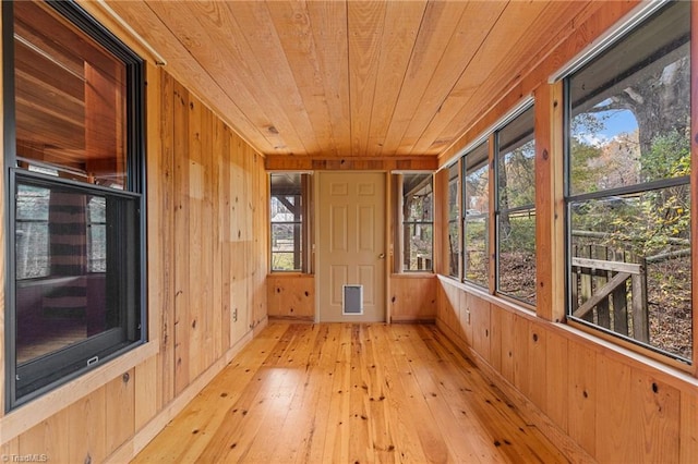 unfurnished sunroom featuring wooden ceiling