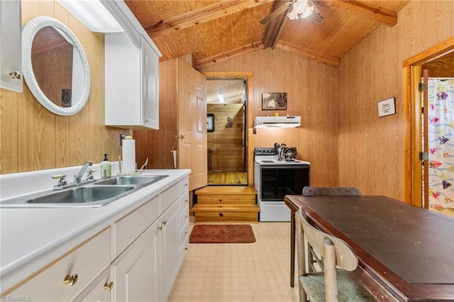 kitchen featuring vaulted ceiling with beams, wooden walls, white cabinets, and white electric stove