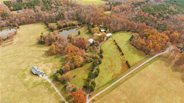 drone / aerial view featuring a rural view and a water view