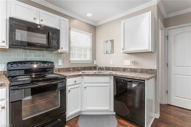 kitchen with white cabinetry, sink, ornamental molding, and black appliances