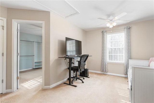 office space with ceiling fan and light colored carpet