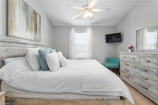 carpeted bedroom with ceiling fan