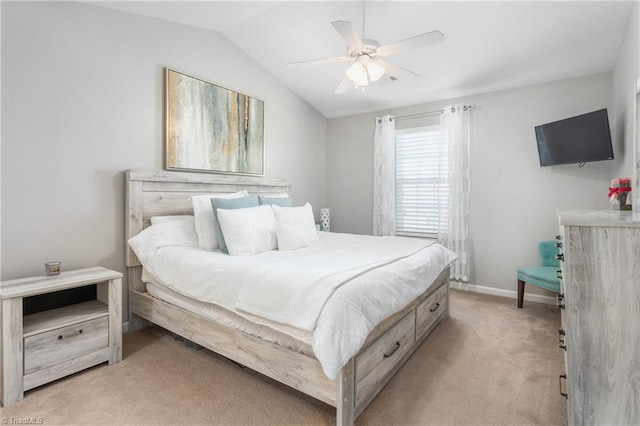 carpeted bedroom with ceiling fan and lofted ceiling