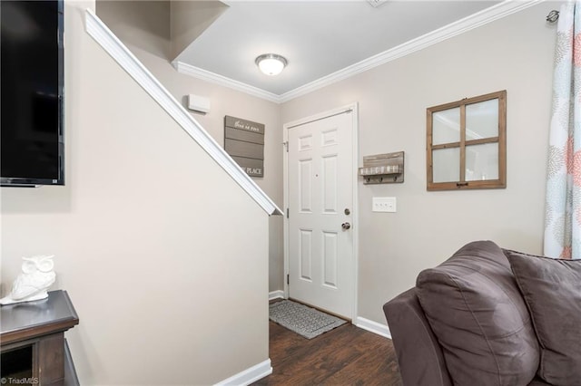 entryway with dark hardwood / wood-style flooring and crown molding