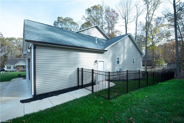 view of side of home featuring a yard