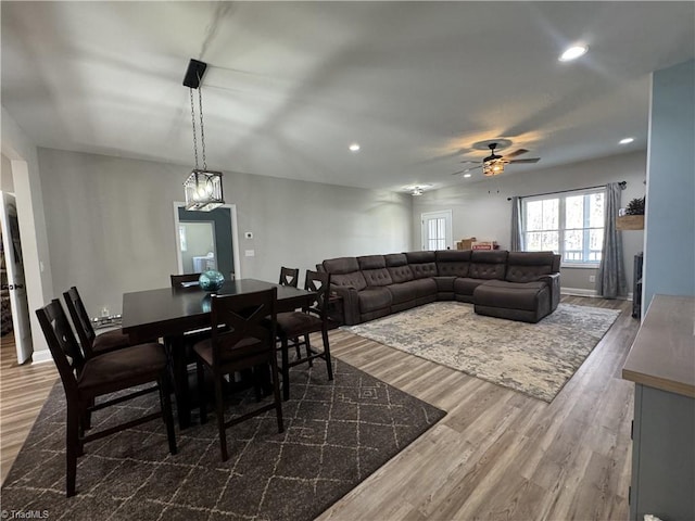 dining space featuring ceiling fan and dark hardwood / wood-style floors