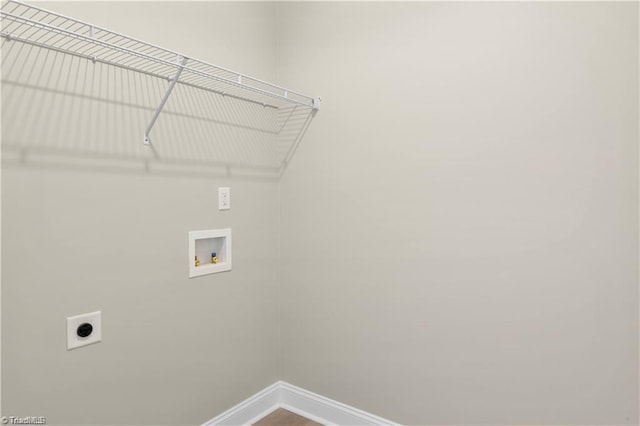 laundry area with hookup for an electric dryer and washer hookup