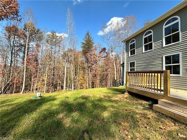 view of yard with a wooden deck