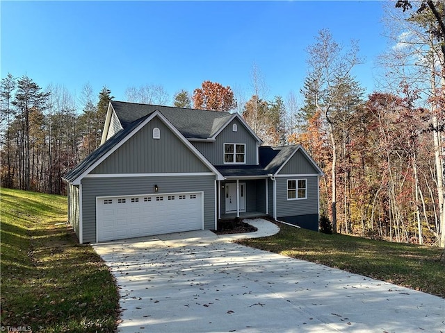 view of front of house featuring a front yard and a garage