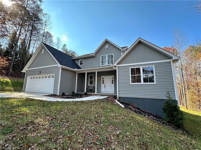 view of front of home featuring a garage and a front yard