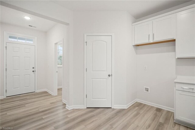 5365 Roshni Ter, Mcleansville, NC 27301 - interior space with laundry area, light wood finished floors, baseboards, and visible vents