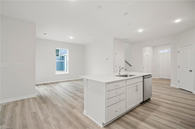 5365 Roshni Ter, Mcleansville, NC 27301 - kitchen featuring light countertops, light wood-style floors, dishwasher, and a sink