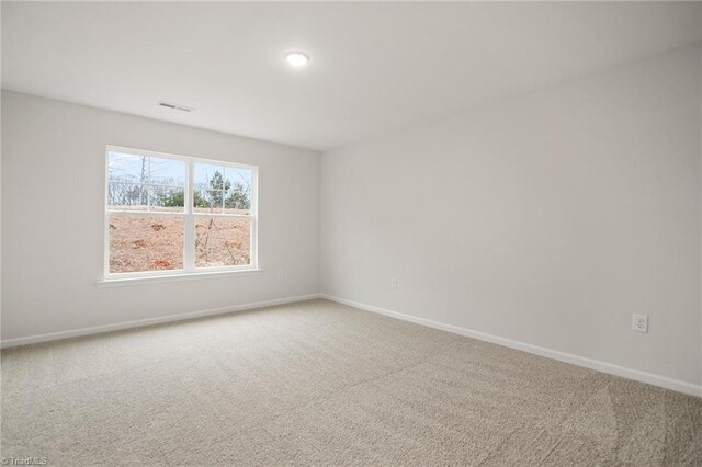 5365 Roshni Ter, Mcleansville, NC 27301 - carpeted spare room with visible vents and baseboards