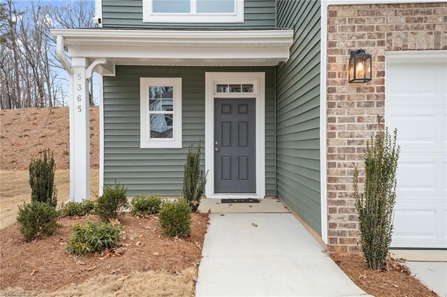 5365 Roshni Ter, Mcleansville, NC 27301 - property entrance featuring a garage