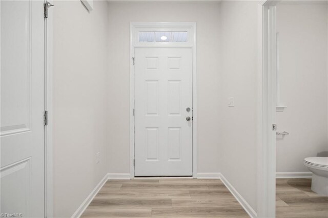 5365 Roshni Ter, Mcleansville, NC 27301 - entryway with light wood-style floors and baseboards