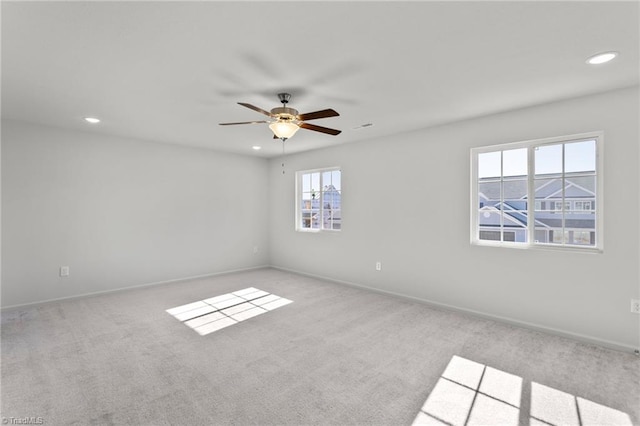 empty room featuring recessed lighting, carpet flooring, baseboards, and ceiling fan