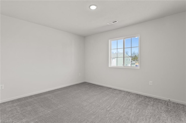 unfurnished room featuring recessed lighting, carpet, visible vents, and baseboards