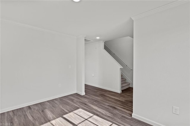 unfurnished living room featuring baseboards, recessed lighting, stairway, crown molding, and wood finished floors