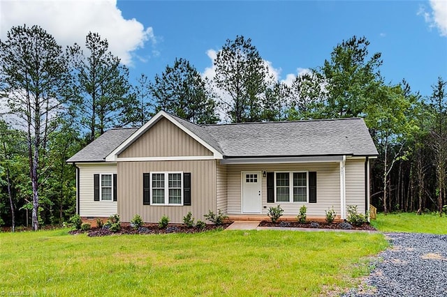 307 Lick Creek Church Rd, Denton, NC 27239 - ranch-style home featuring a front yard, roof with shingles, and covered porch