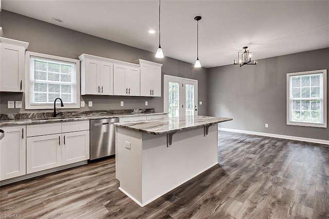 307 Lick Creek Church Rd, Denton, NC 27239 - kitchen with a sink, stainless steel dishwasher, light stone counters, a kitchen island, and white cabinets