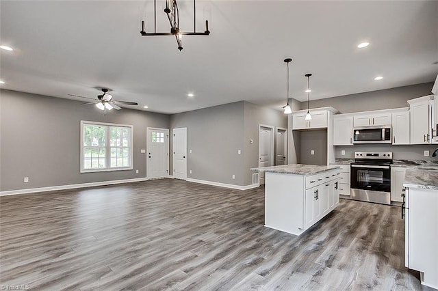 307 Lick Creek Church Rd, Denton, NC 27239 - kitchen featuring appliances with stainless steel finishes, ceiling fan, white cabinets, baseboards, and open floor plan