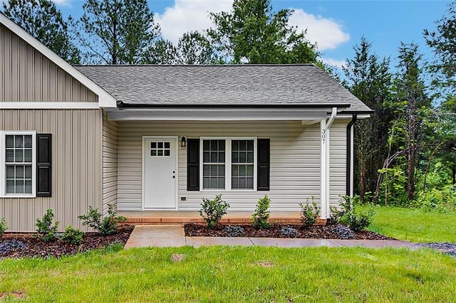 307 Lick Creek Church Rd, Denton, NC 27239 - view of front facade featuring a front yard, a porch, and roof with shingles